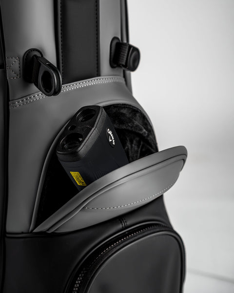 Player Preferred™ Golf Bag in Flat Ash color, showcasing a sleek design with multiple pockets and a comfortable strap, ideal for carrying golf essentials.