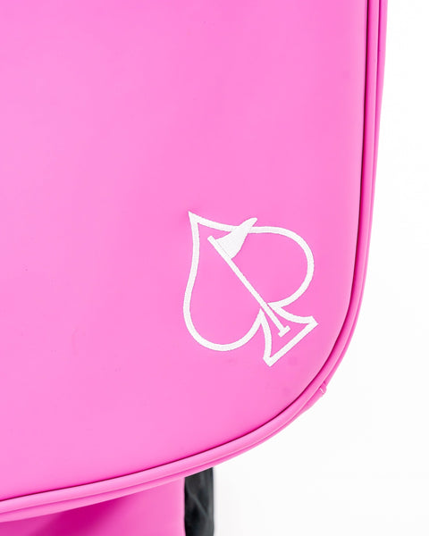 Bold pink golf bag featuring a white spade logo, designed for golfers who want to make a statement on the course.