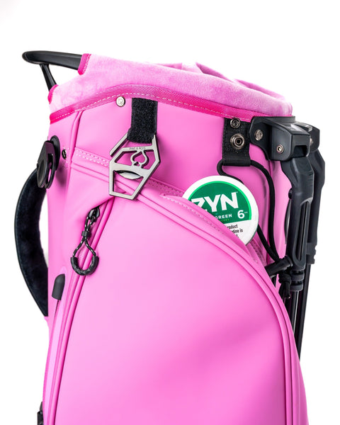 Bold pink Player Preferred Golf Bag featuring a sleek design and convenient pockets for golf accessories.